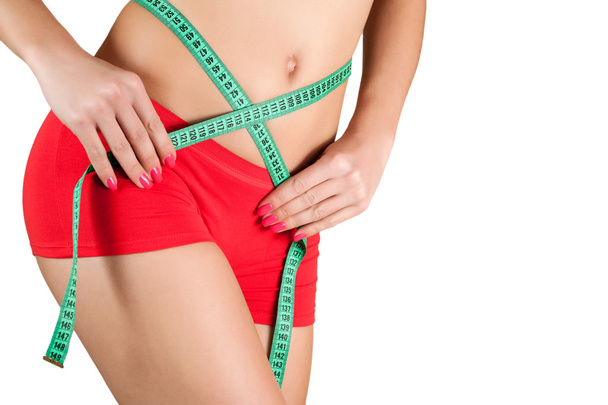 Woman measuring perfect shape of beautiful hips. - Photo, image