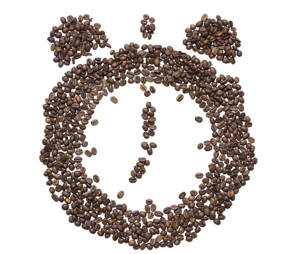 El dial del reloj con campanas con incrustaciones de granos de café tostados que muestran siete de la mañana o la noche
 - Foto, Imagen