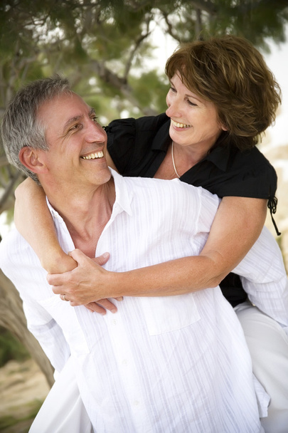 Mature couple smiling and embracing. - Foto, Bild