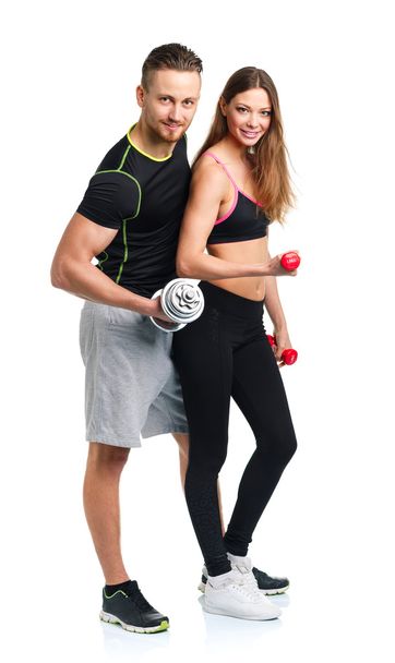 Atletik erkek ve kadın üzerinde beyaz dumbbells ile - Fotoğraf, Görsel