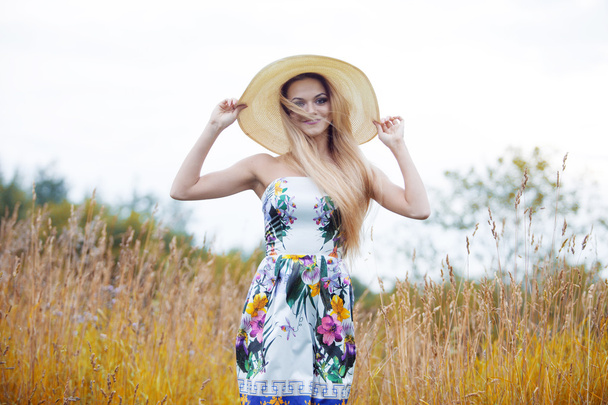 Beauty  women  in a straw hat alone with nature, freedom concept. - Photo, image