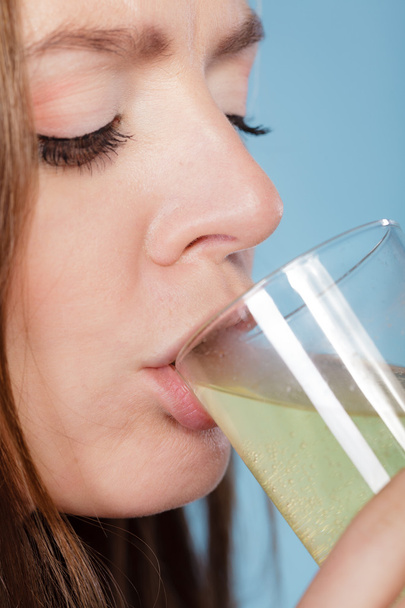 Woman drink pill dissolved in water. Health care. - Фото, зображення