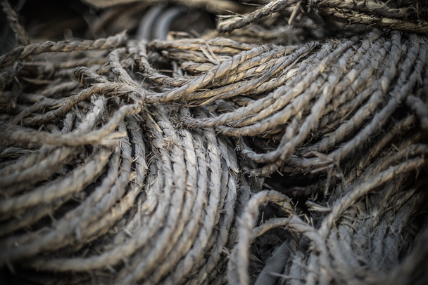 Ship ropes heap. Pile of various ropes and strings. Closeup of cordage. Background nautical texture - 写真・画像