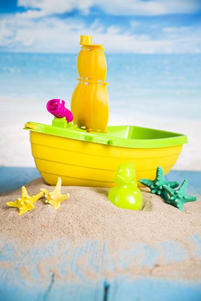 Vacation, sand, colorful molds for the sandbox, flip-flops colorful shells, the belt for swimming - Fotó, kép