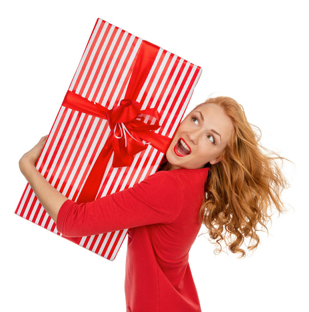 Happy young woman hold red Christmas wrapped gift present smilin - Photo, Image