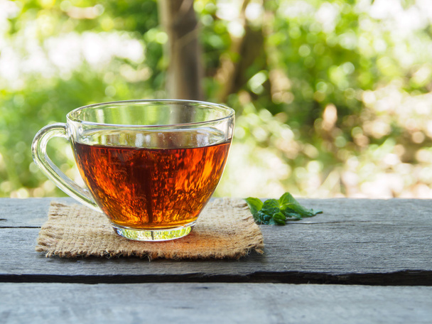 Tea cup on wooden - Фото, изображение