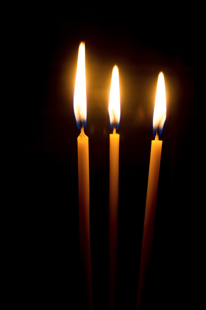Three yellow wax candles - Zdjęcie, obraz