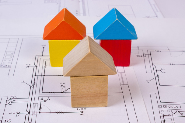 Houses of wooden blocks on construction drawing of house, building house concept - Photo, Image