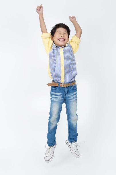 Portrait of asian cute boy is jumping  - Valokuva, kuva