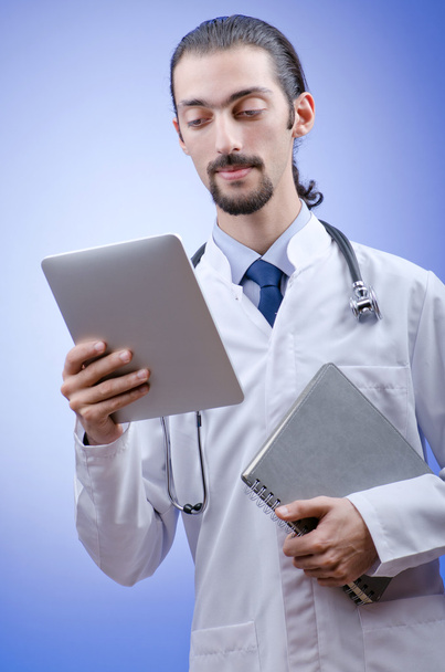 Doctor working on the tablet - Photo, Image