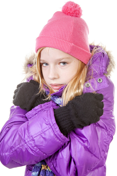 young girl in winter outfit heaving cold over white background - Photo, image