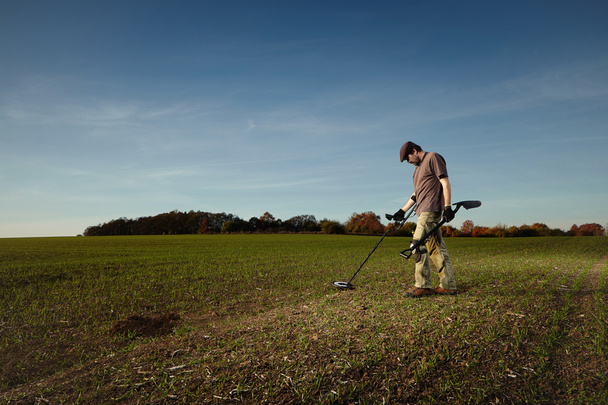 Amateur treasure hunter in fields - Photo, Image