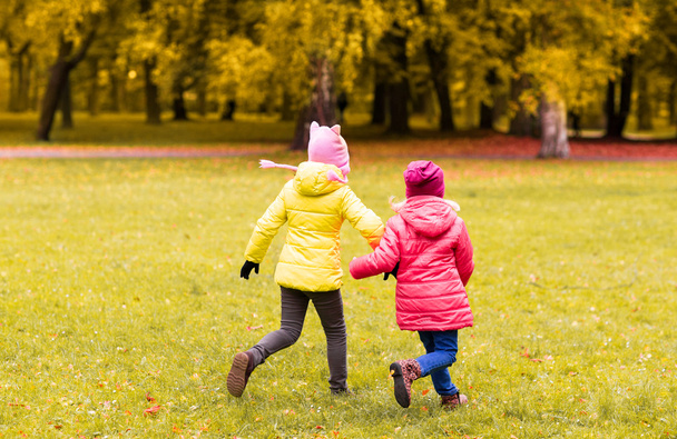 happy little girls running outdoors - Fotografie, Obrázek
