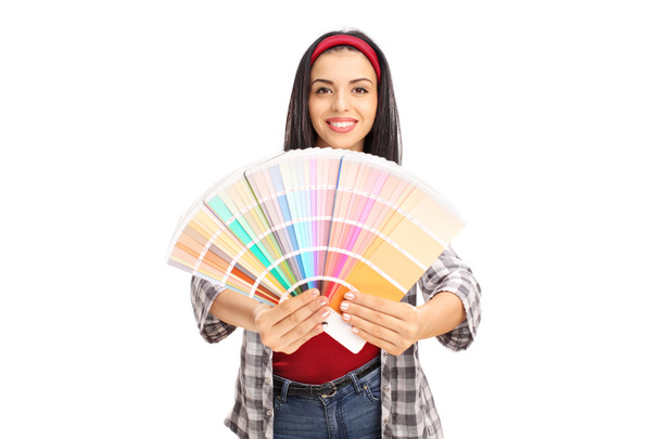 cheerful woman holding color swatch - Фото, изображение