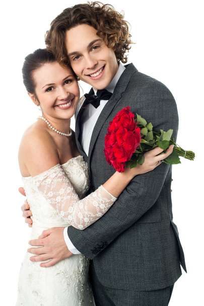 wedding couple with red flowers - Фото, зображення