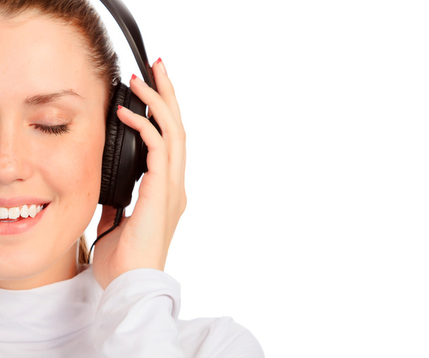 Closeup portrait of pretty young girl listening music. - Photo, Image
