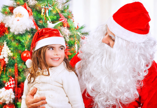 Little girl with Santa Claus - Фото, изображение