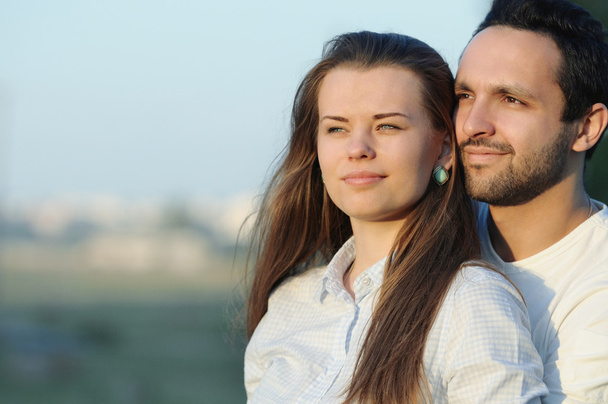 portrait of young sensual couple on sunset - Photo, Image