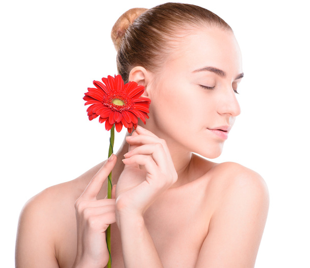 Beautiful woman with red gerbera. Isolated on white background - Foto, Imagen