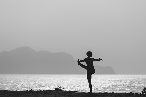 Woman meditating in yoga pose silhouette - Φωτογραφία, εικόνα