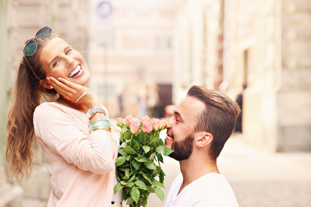 Romantic couple getting engaged in the city - Photo, Image
