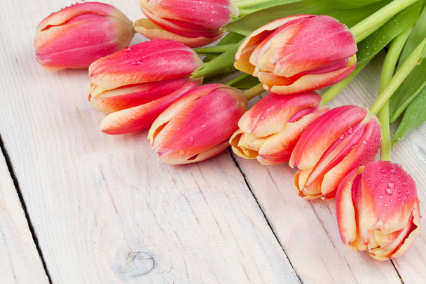 Colorful tulips on wooden table - Photo, Image