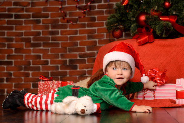 little boy in costume in christmas interior - Foto, imagen