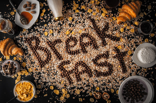 Breakfast word made by chocolate crispy ball in the frame of the breakfast attributes - Zdjęcie, obraz