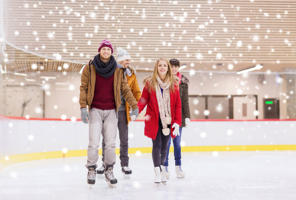 happy friends on skating rink - Foto, Bild