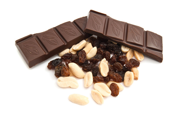 raisins, peanuts and chocolate on white - Фото, изображение