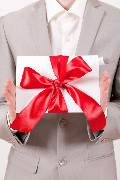 Gift with decorative red ribbon bow - Foto, Imagem