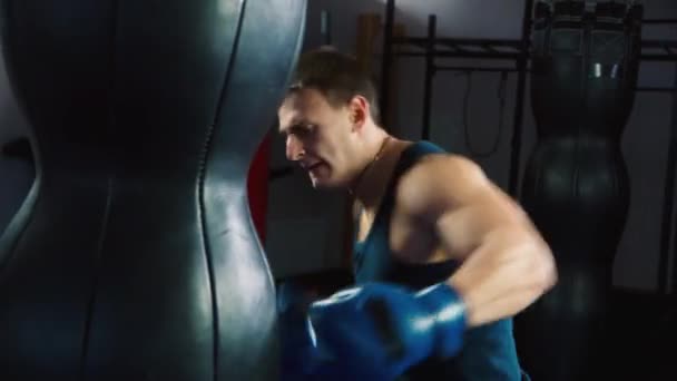 Boxing Workout:  training with a punching bag in a boxing club. - Video