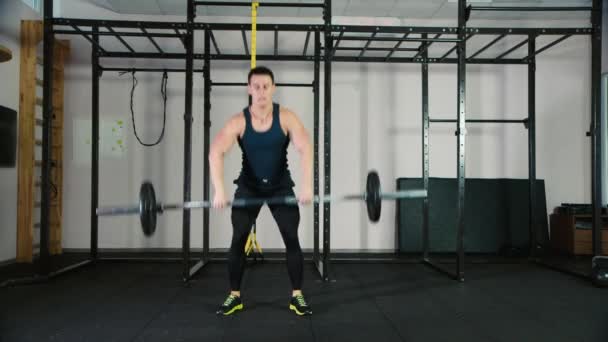 An athlete trains with a barbell - Filmati, video
