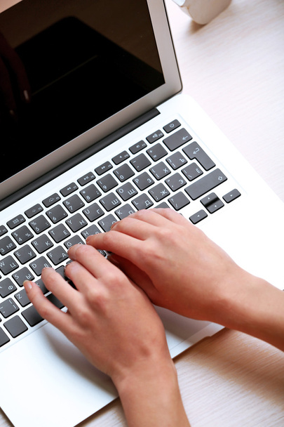 Woman using laptop on workplace close up - Zdjęcie, obraz