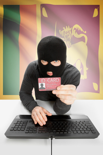 Hacker with flag on background holding ID card in hand - Sri Lanka - Photo, Image