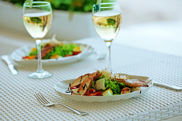 Tasty salad on white served table - Foto, imagen