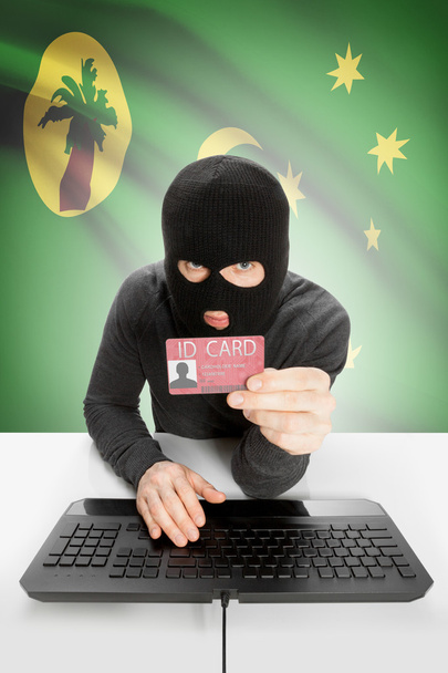 Hakkeri, jolla on lippu taustalla henkilökortti kädessä - Kookossaaret - Valokuva, kuva