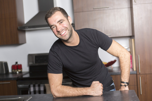 Portrait of happy young man at home - Foto, afbeelding