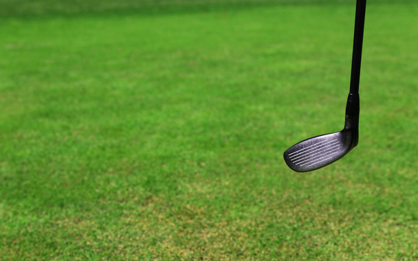 Expensive golf club on green luxury golf course, close up - Fotó, kép