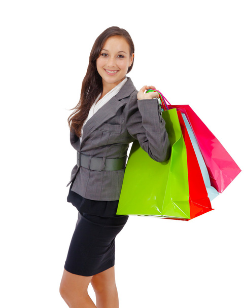 Stunning young woman carrying shopping bags - Foto, Imagen