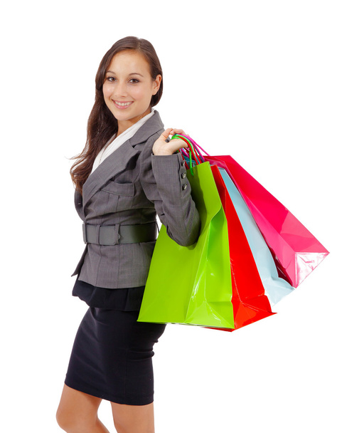 Stunning young woman carrying shopping bags - Foto, Imagen