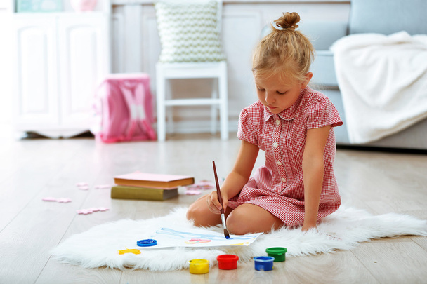 Little girl drawing in the room - Photo, Image