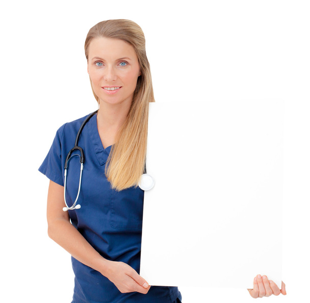 Nurse / doctor showing blank clipboard sign. - Foto, Bild