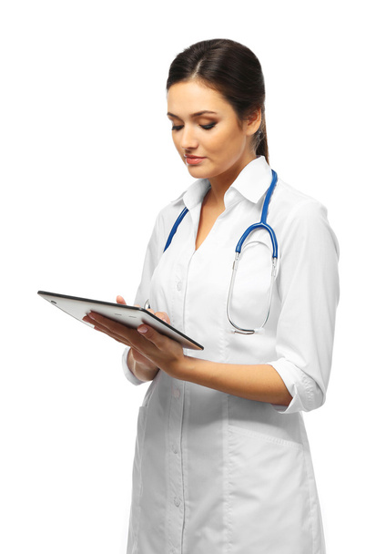 Smiling medical doctor holding a tablet - Photo, Image