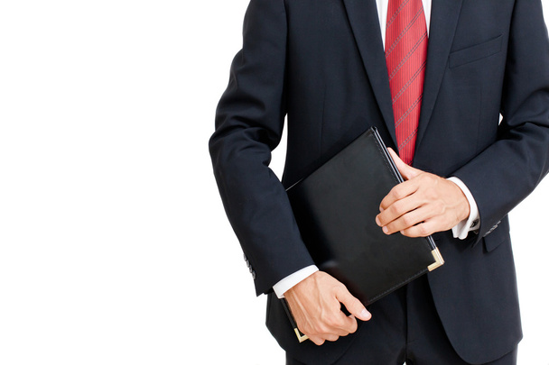 Portrait of a businessman holding a folder - Photo, Image