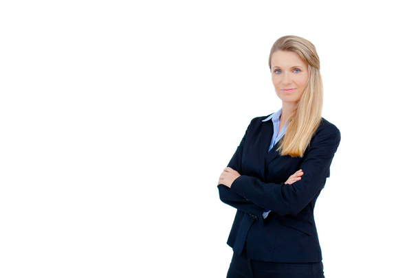 Blond businesswoman standing with crossed arms - Foto, Imagen