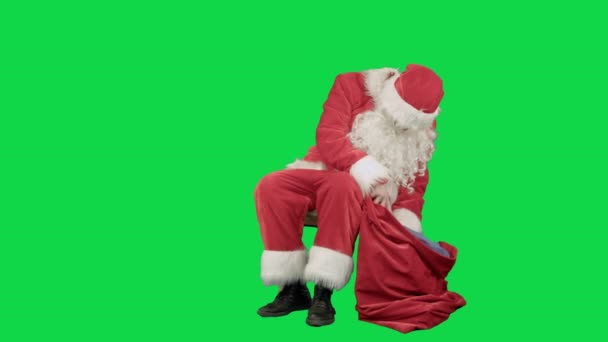 Santa Claus on the tablet in the New Year on a Green Screen Chrome Key - Filmagem, Vídeo