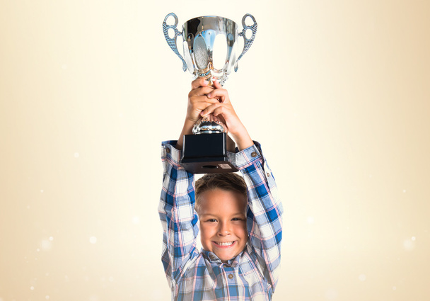 Kid holding a trophy - Фото, зображення