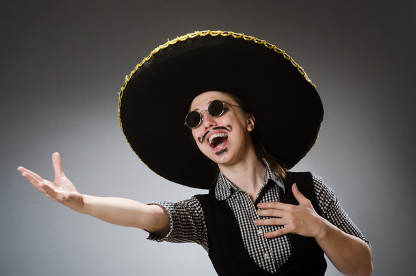 Person wearing sombrero hat in funny concept - Foto, imagen