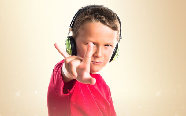 Kid listening music making horn gesture - Photo, Image